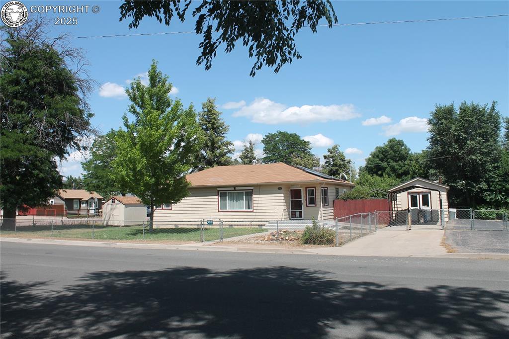 1010 N 10th Street Canon City, Colorado Solar on this house. Say goodbye to electric bills. System is free and clear. No lease to take over.Well maintained, move in ready 3 bedroom 1 bath home located on a fully fenced large corner lot with many large mature trees in central Canon City. This home offers a fully fenced yard and a privacy fenced area off the back door, great for the BBQ and sitting area in privacy. 1 car garage that is currently set up as a workshop could be a parking garage with the installation of a garage door) and a second shed for the yard and gardening tools. The home features original hard wood floors in the living area and 2 bedrooms. Kitchen, laundry room and bathroom all have ceramic tile floors. Ceiling fans in the family room and bedrooms. Full bath with tile shower. Newer vinyl windows throughout the home. The foundation has been remediated and a new front cement porch. Carport and RV parking. 1 car detached garage that is currently being used as a shop. Large laundry room. Large living area and open kitchen with nice cabinetry.