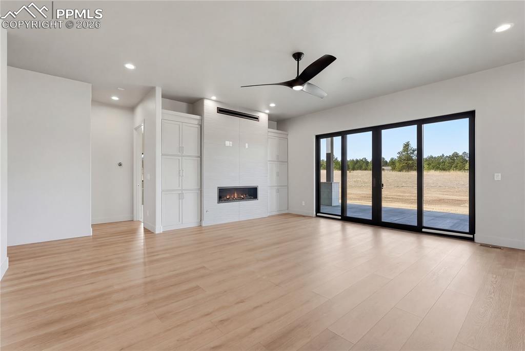 Gorgeous fireplace wall and oversized sliding glass door.