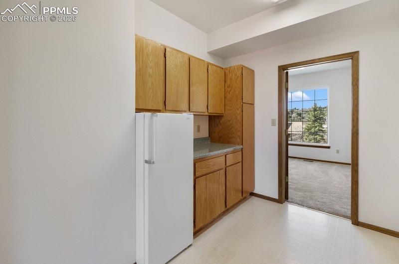Extra room off kitchen that could be used as a pantry or laundry area