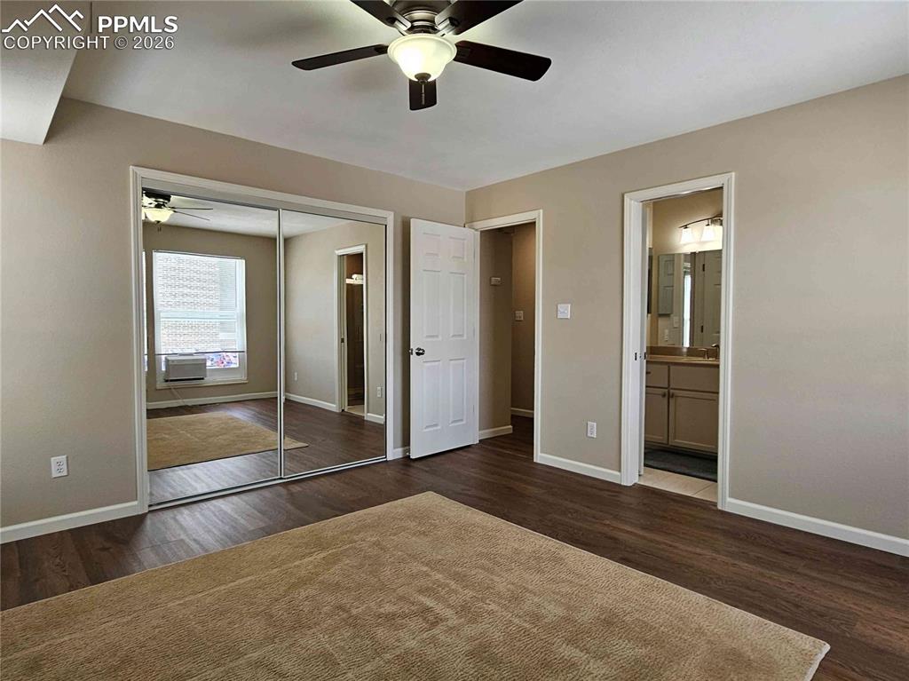 Primary Bedroom with door to upper level bath.