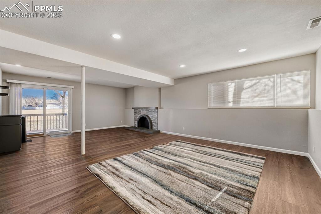 Lower level Family room, plumbed for wet bar and wood burning fireplace.