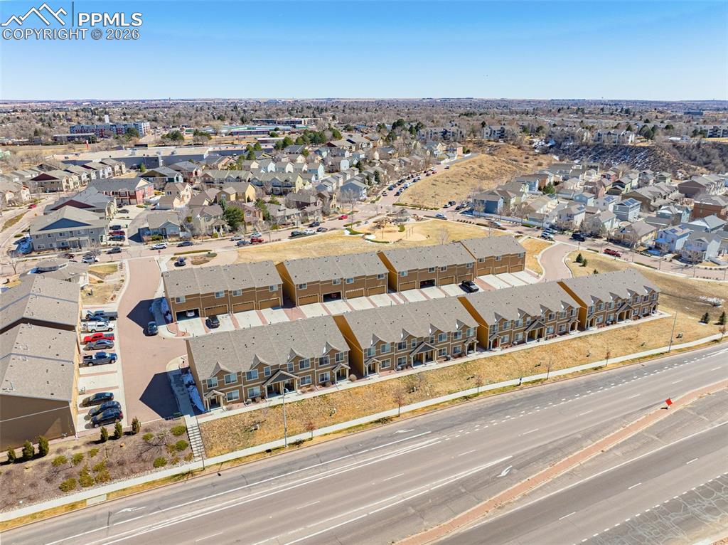 Aerial overview of property's location featuring nearby suburban area