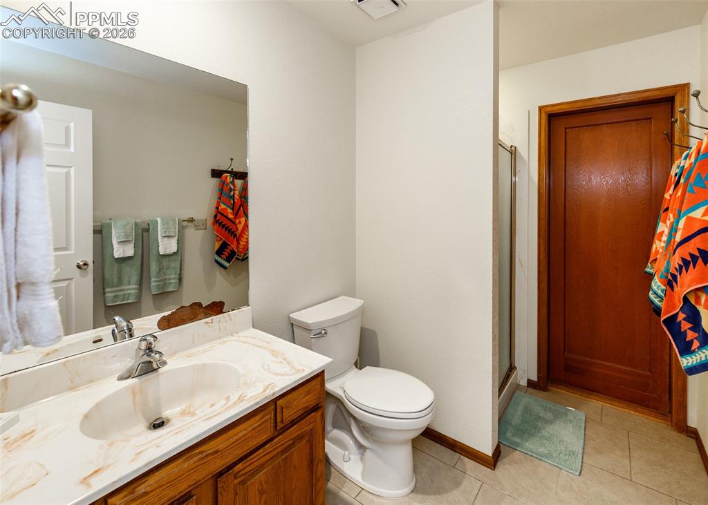 This main level restroom is a readily accessible restroom providing easy poolside access
