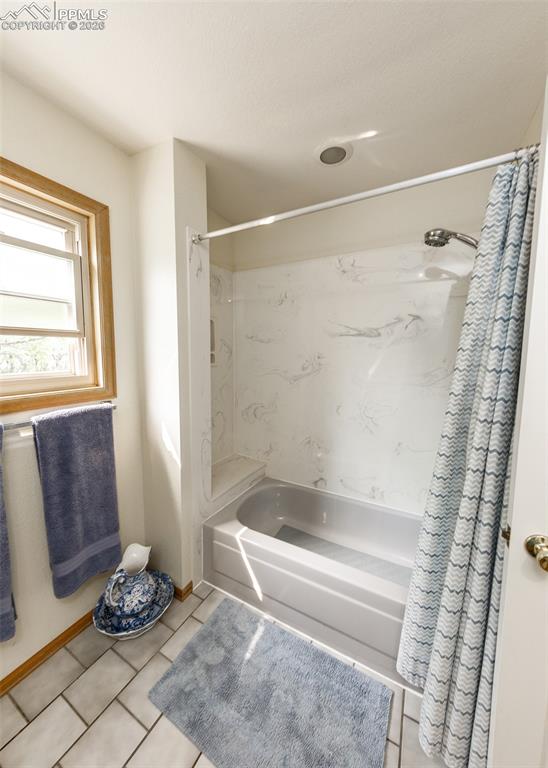 Main floor full bathroom, featuring a well-lit space with modern fixtures and a comfortable layout, perfect for everyday use and guests.