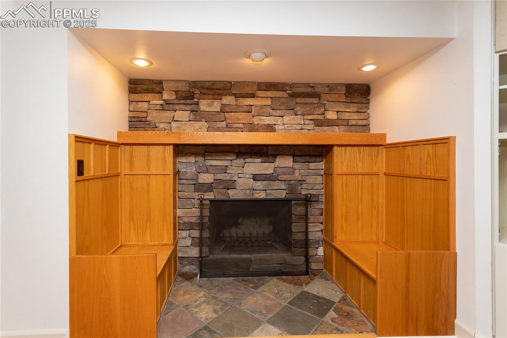 Wood burning fireplace with built-in benches