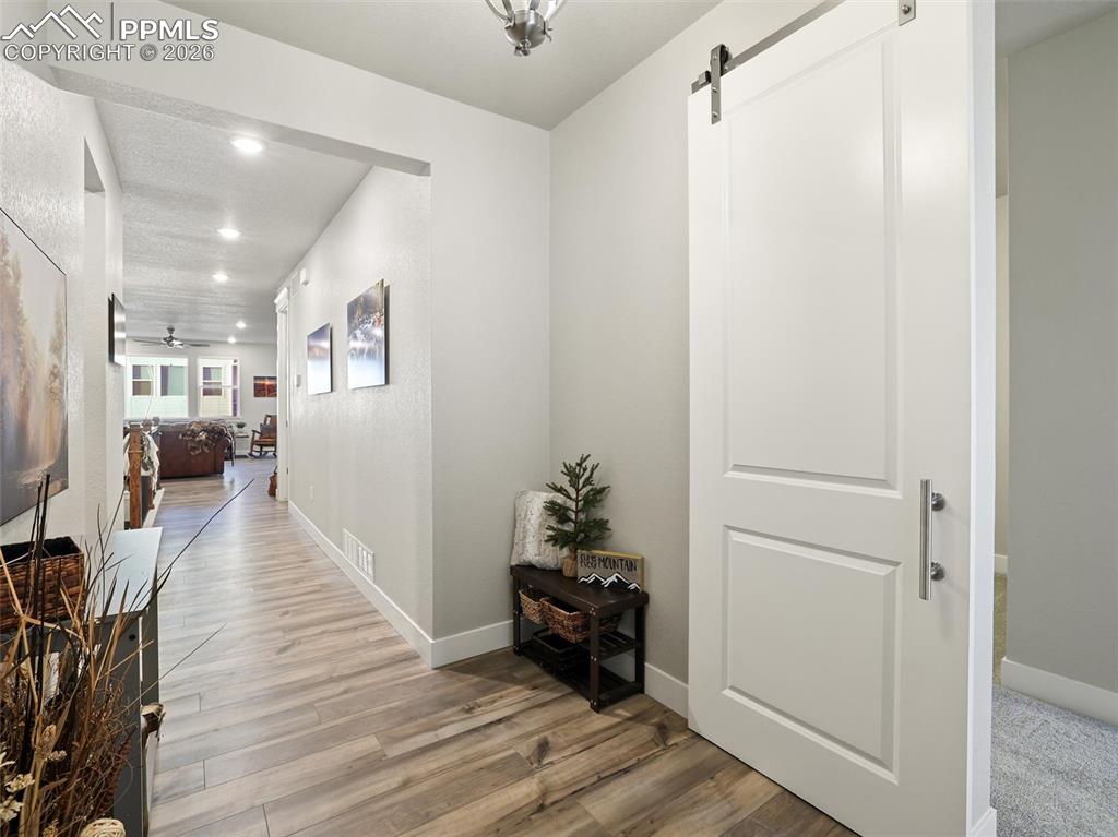 front entry way and entrance into multi gen with barn door