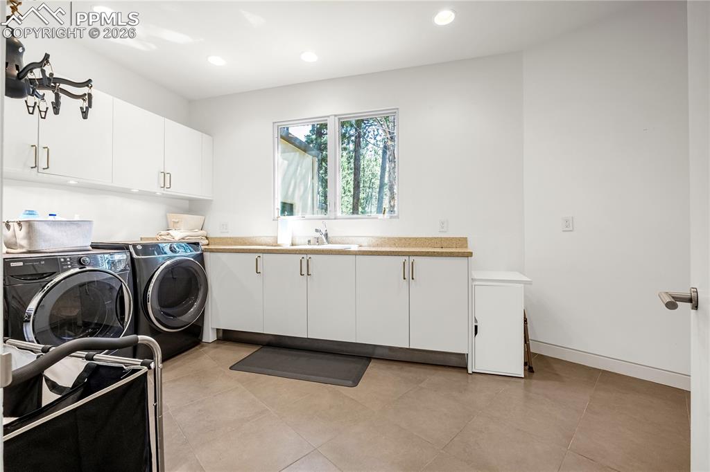 Laundry room adjacent to garage