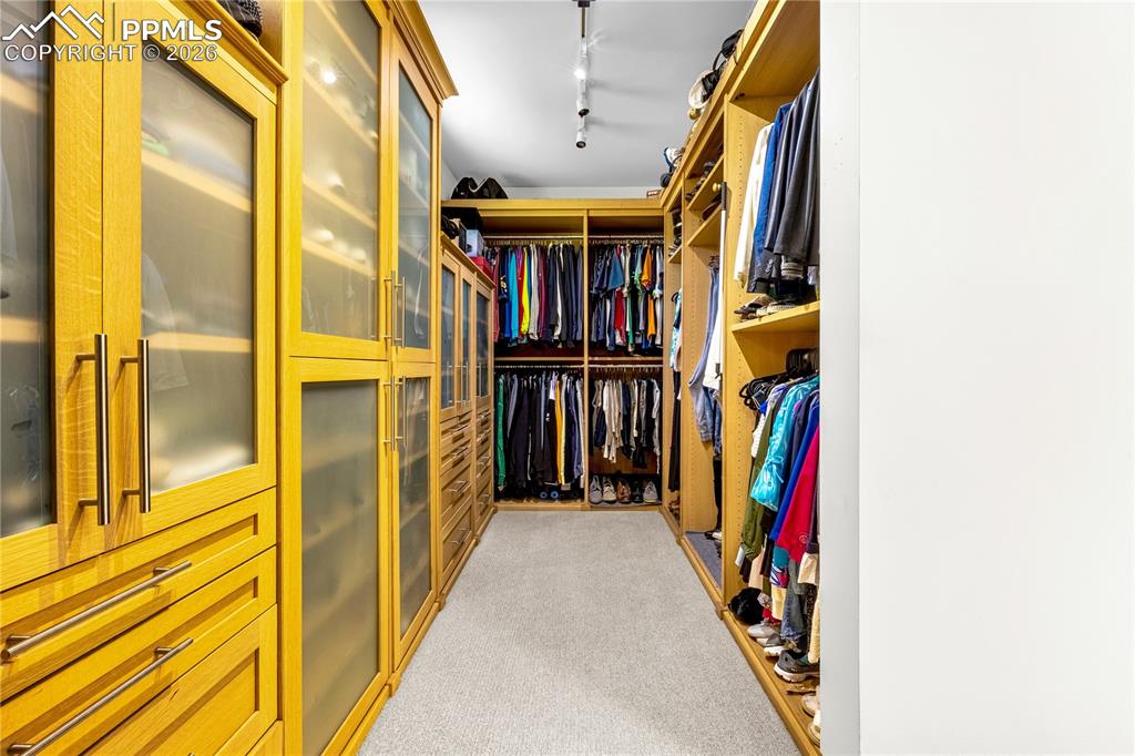 Walk-in primary closet with built-in organization