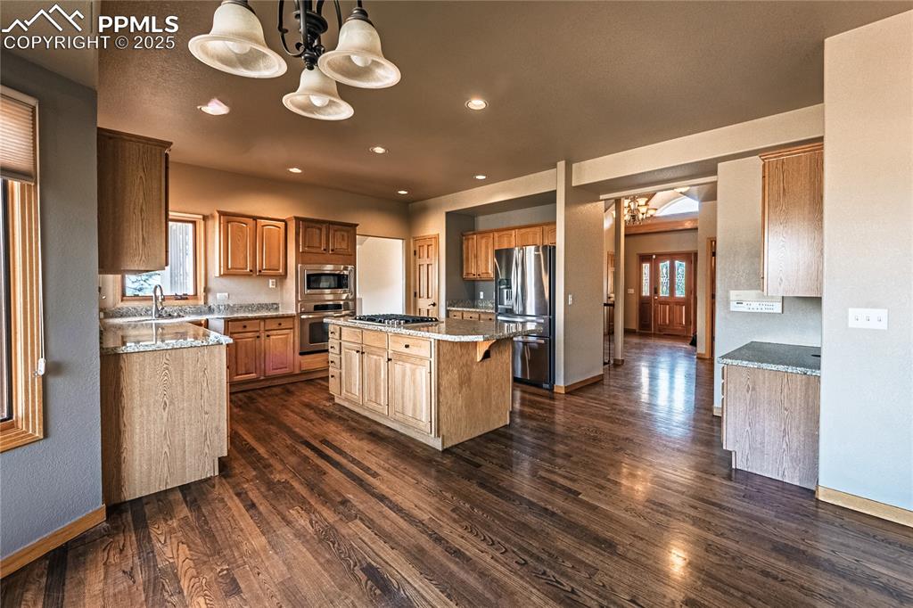 Eat in Kitchen area featuring large windows that
provide abundant natural light and a view of the outdoor space, ideal for gatherings.
