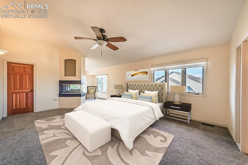 Virtually Staged
Bedroom with carpet floors and a ceiling fan
