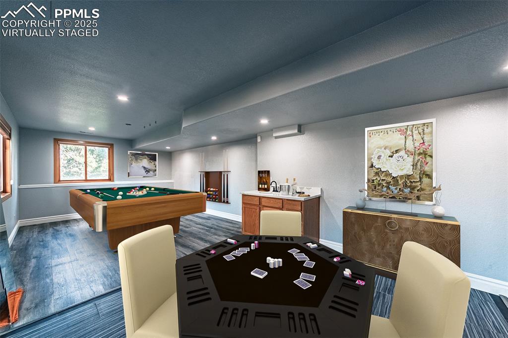 Virtually Staged
Playroom with pool table, wood finished floors, recessed lighting, and a textured ceiling