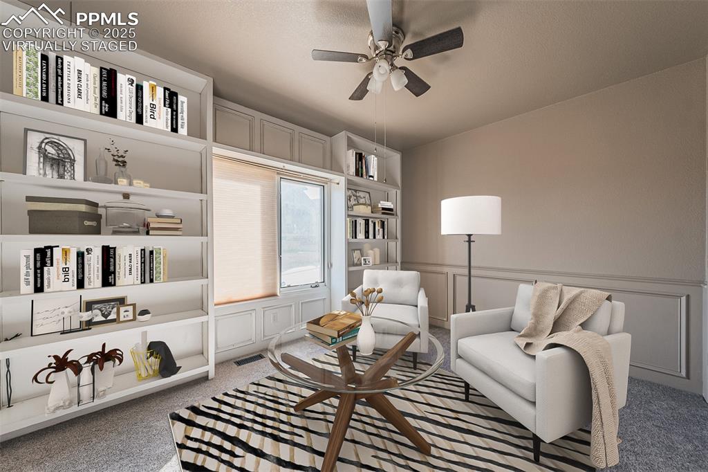Virtually Staged
Carpet, wainscoting, built in books shelves and ceiling fan.