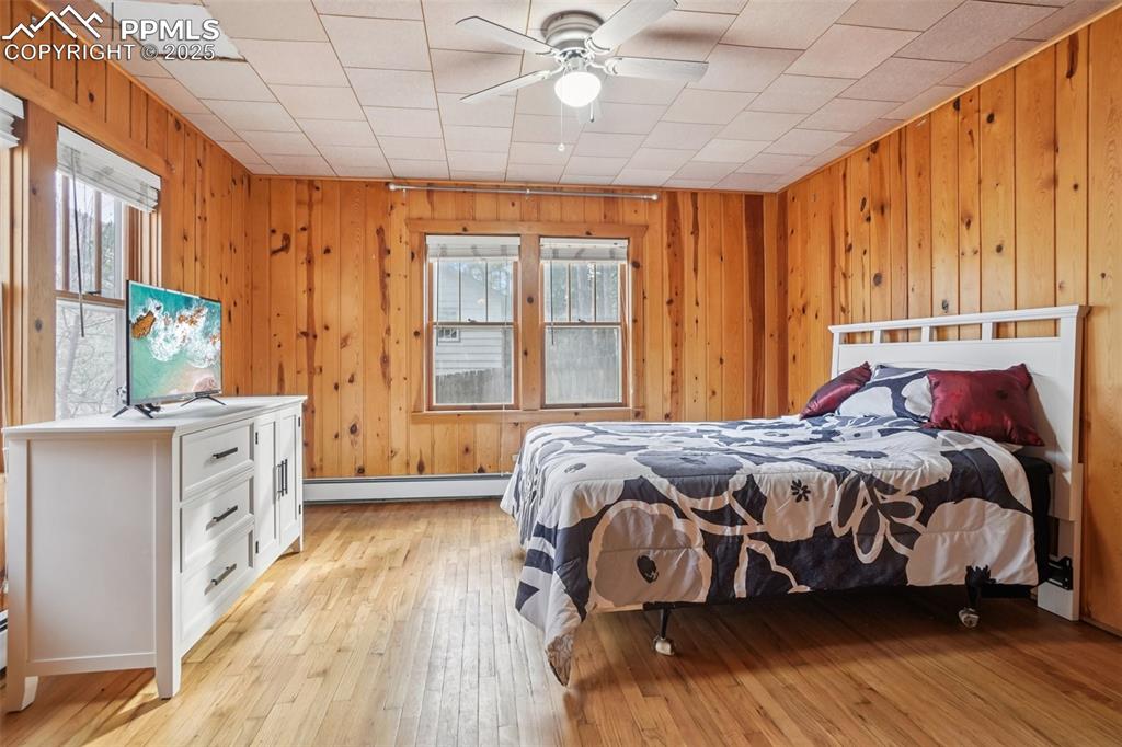 Primary bedroom with walk out to private deck and yard