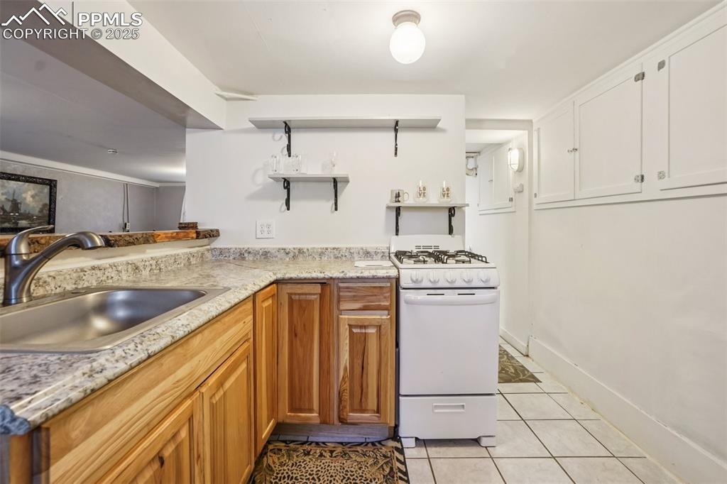 Fully equipped kitchen with gas stove on lower level