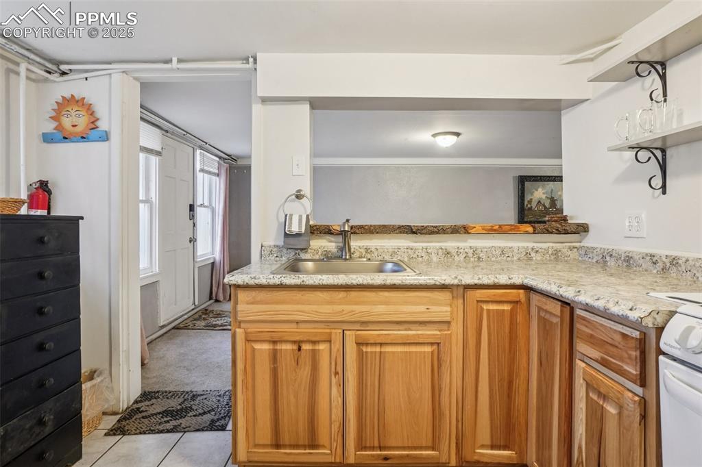 Fully equipped kitchen with gas stove on lower level