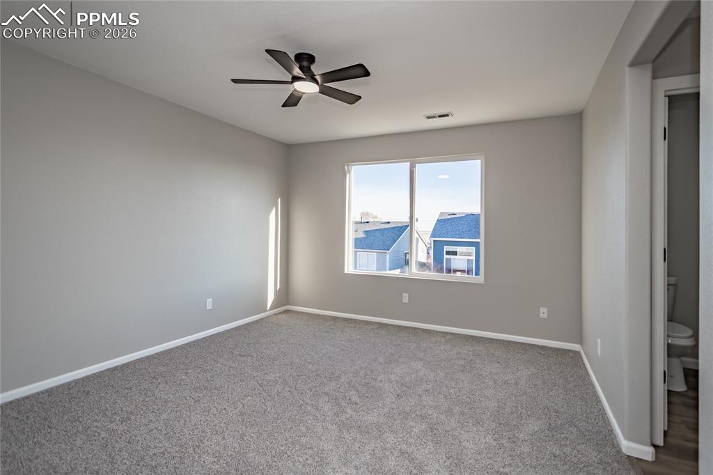 The primary bedroom has an ensuite and walk-in closet, new paint, carpet, outlets, switches and ceiling fan!