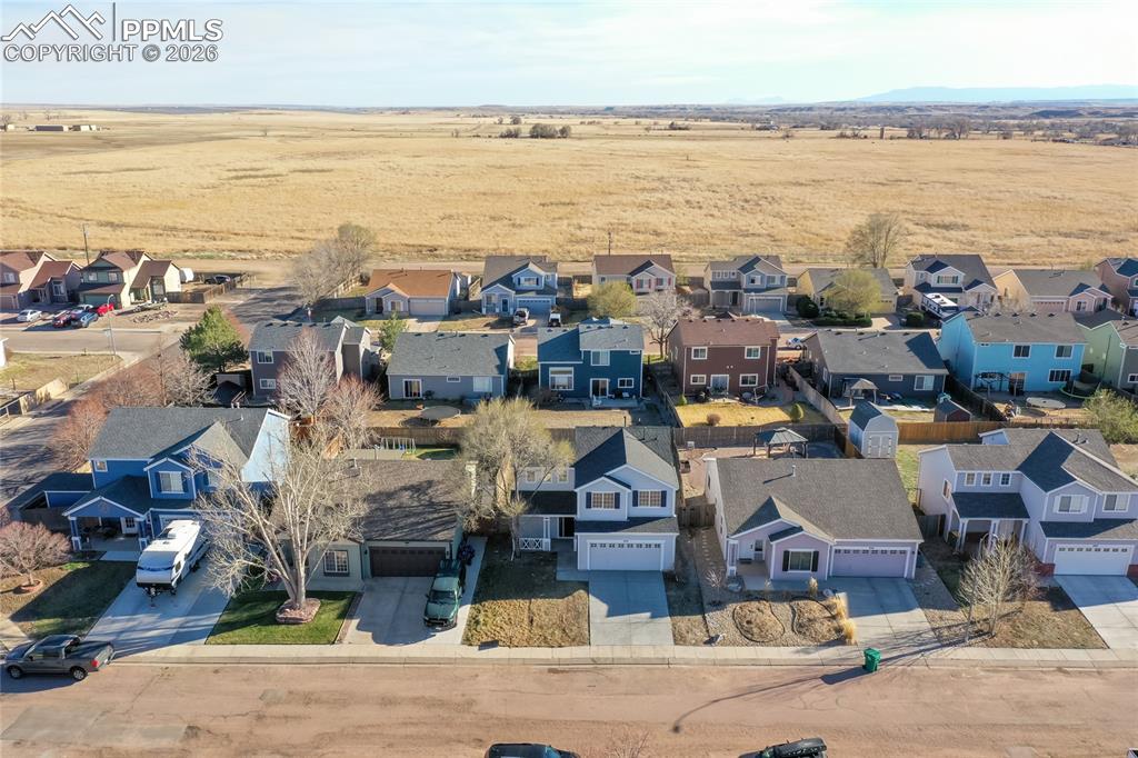 Neighborhood backs to open land.