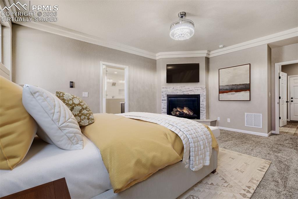 Virtually staged primary Bedroom with fireplace, massive closet, lux 5-piece bath