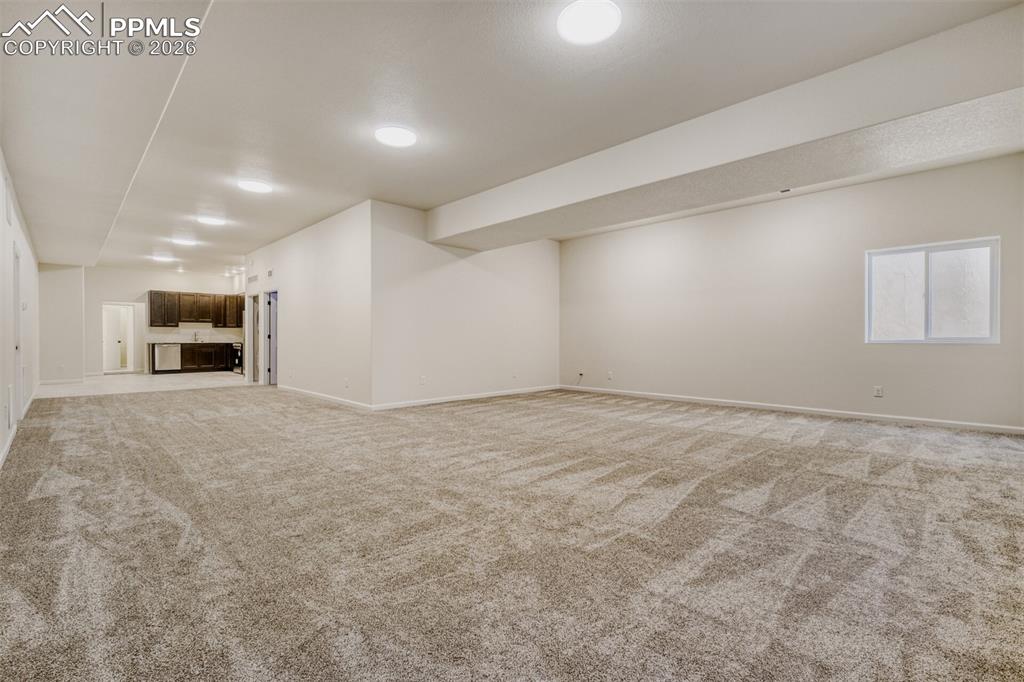 Basement family/game room with kitchenette and second laundry