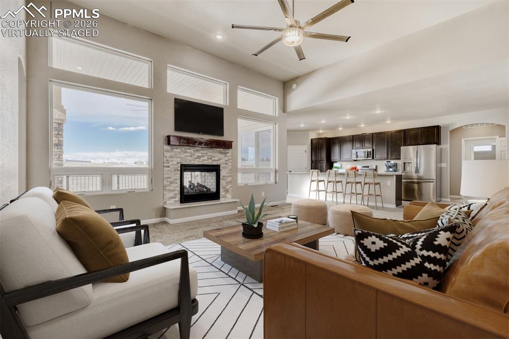 Virtually staged Living Room with open concept and covered deck.
