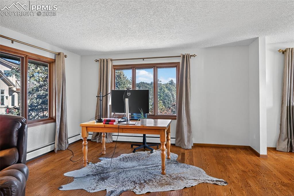 Flex space for an office or sitting area is surrounded by trees!