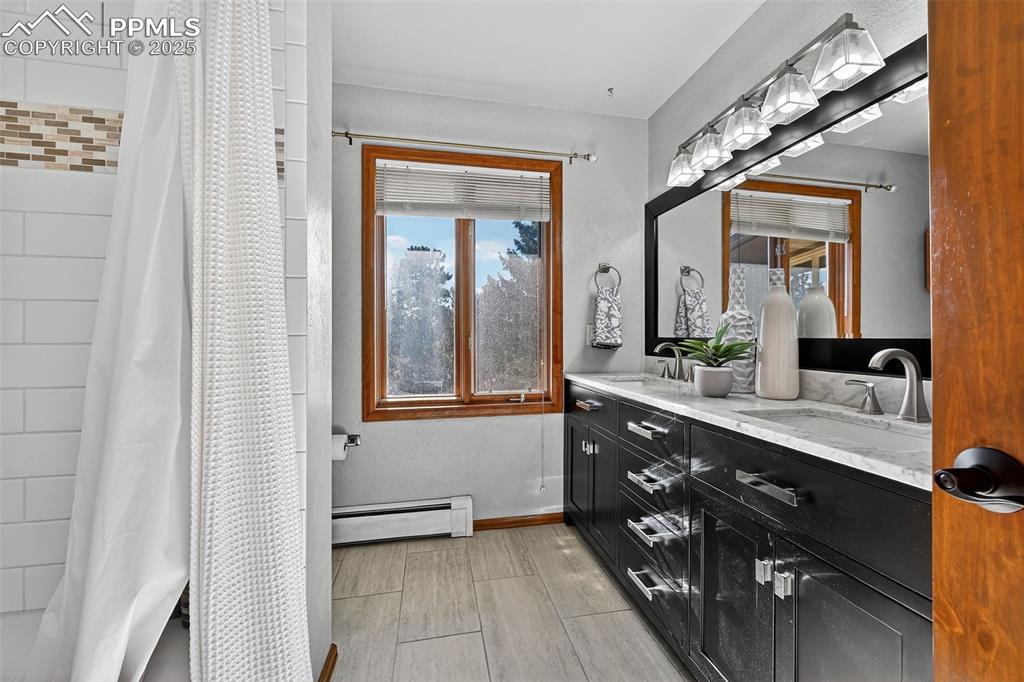 Updated hall bath with quartz counters and two sinks!