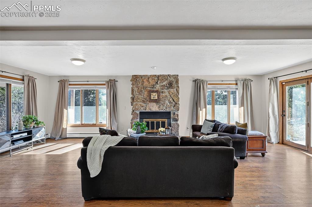 Fun entertaining in your large basement with a cozy fireplace and many windows!