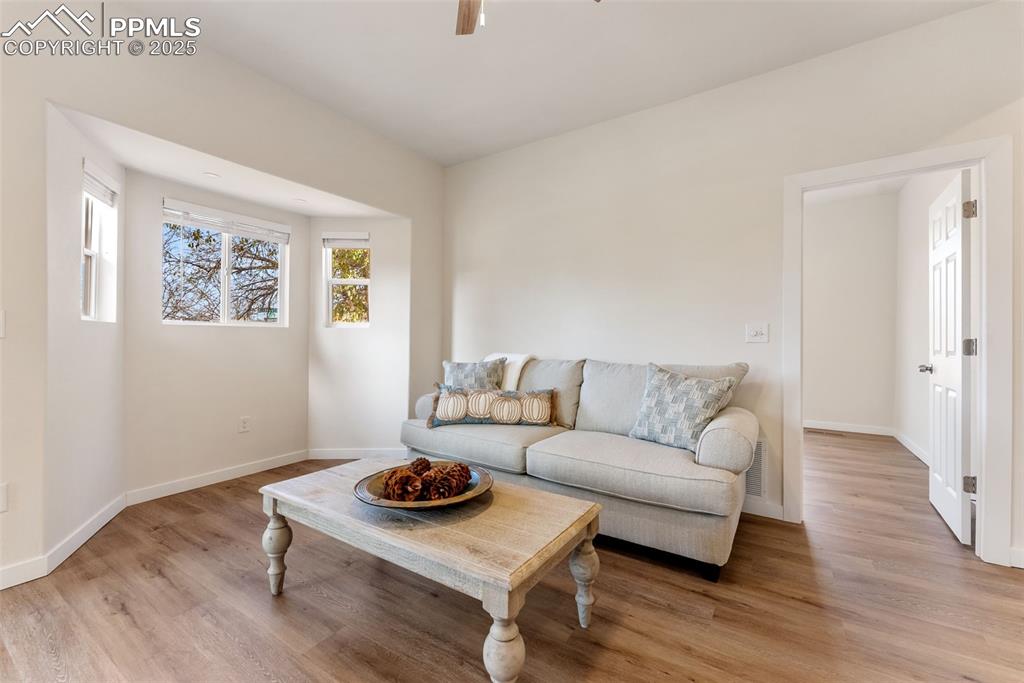 The living room has a bump out for a loveseat couch or a spot for your entertainment setup