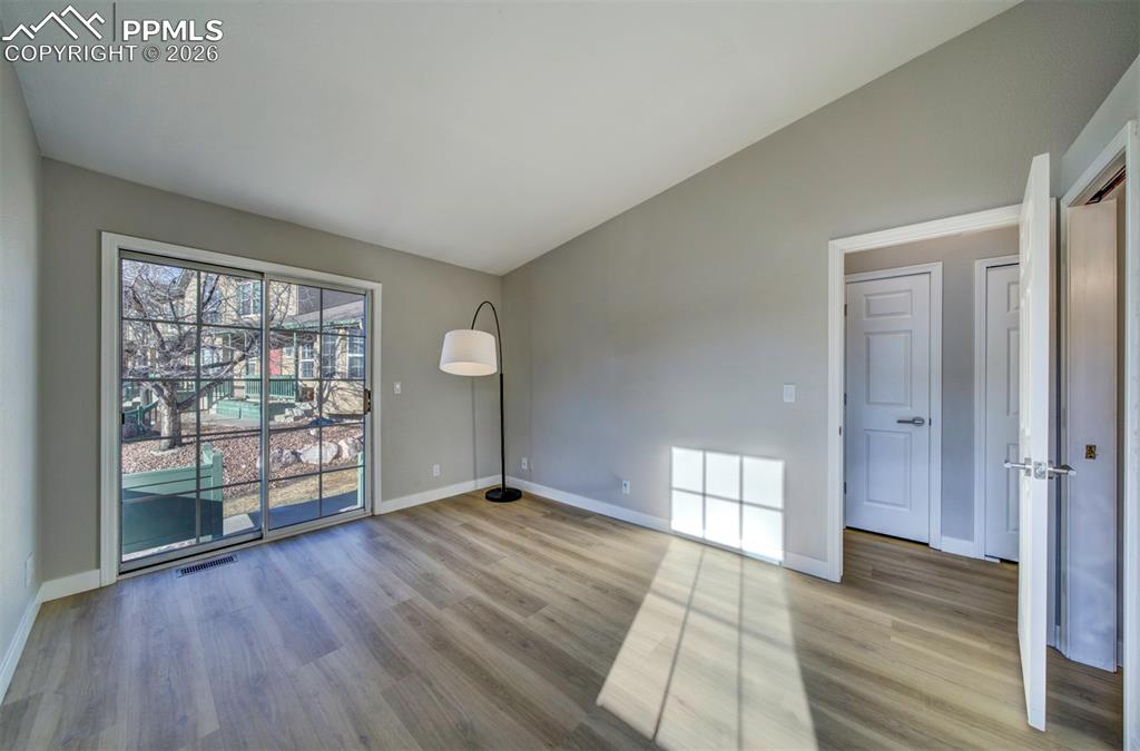 Primary bedroom w/ slider to rear patio