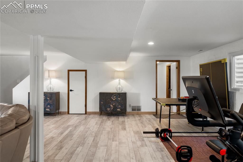 Walkout basement with laminate flooring family room area and plenty of rec space. 