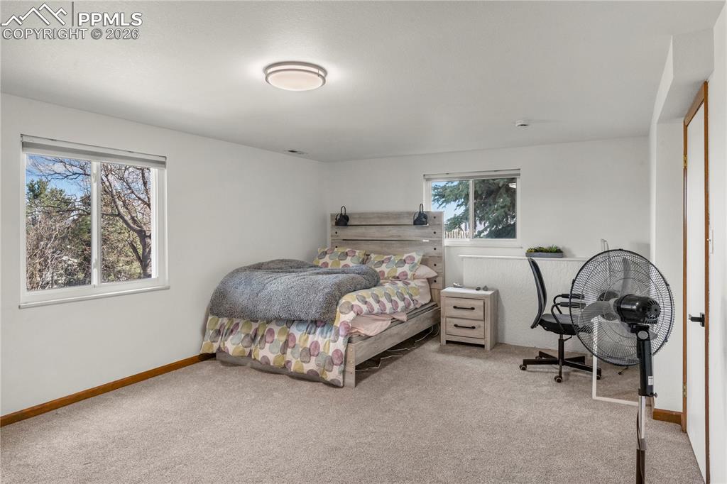 Basement bedroom with carpet. 