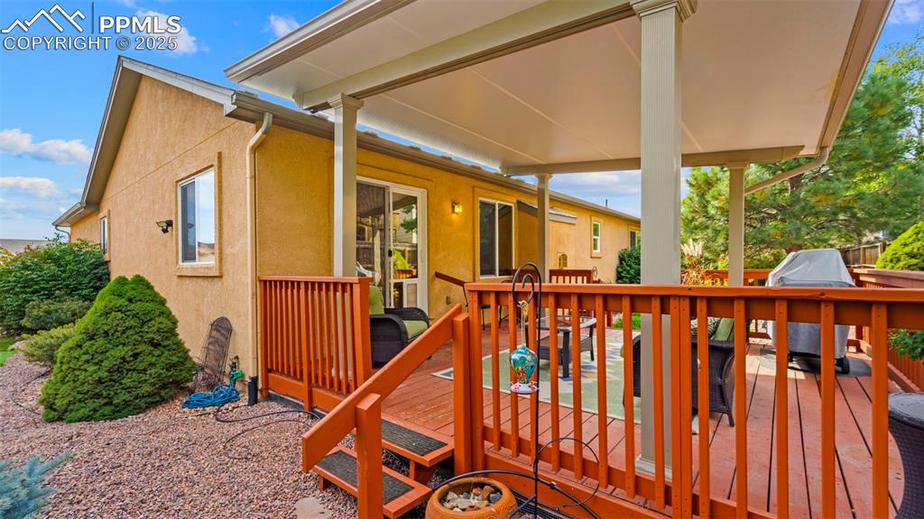 Wooden deck featuring grilling area