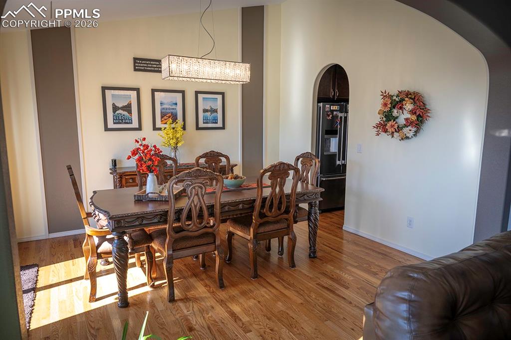 Dining room leading to kitchen on right 