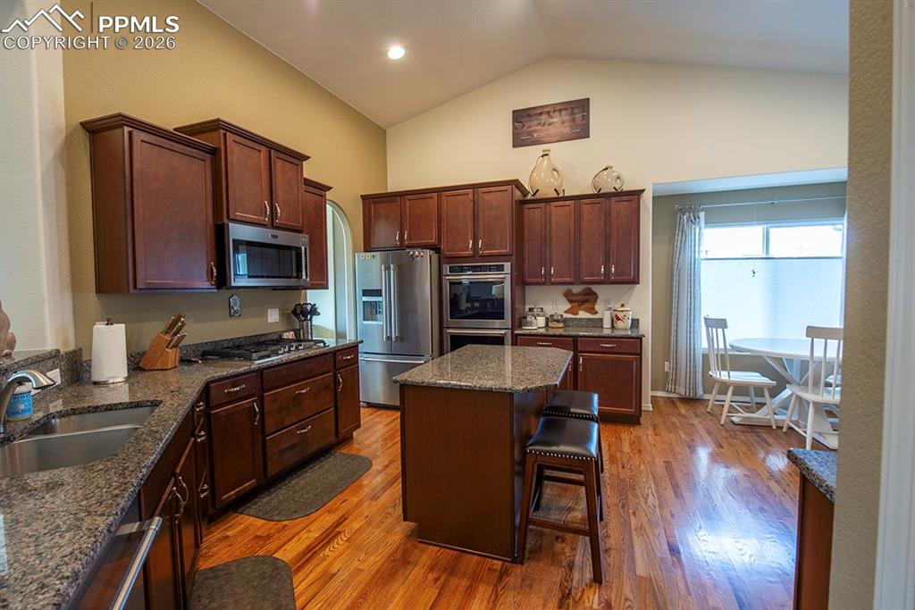 Kitchen with additional area for seating and island