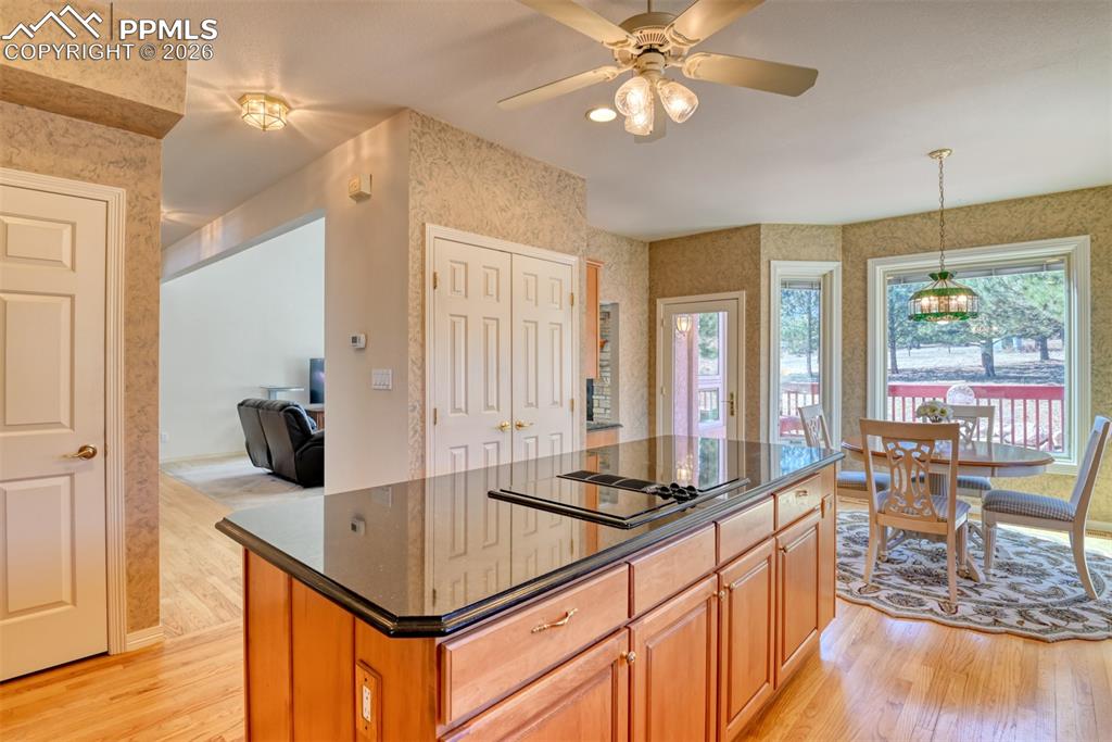 Door on left leads to the unfinished basement, center doors are the pantry, and door on right leads out to the back deck. 