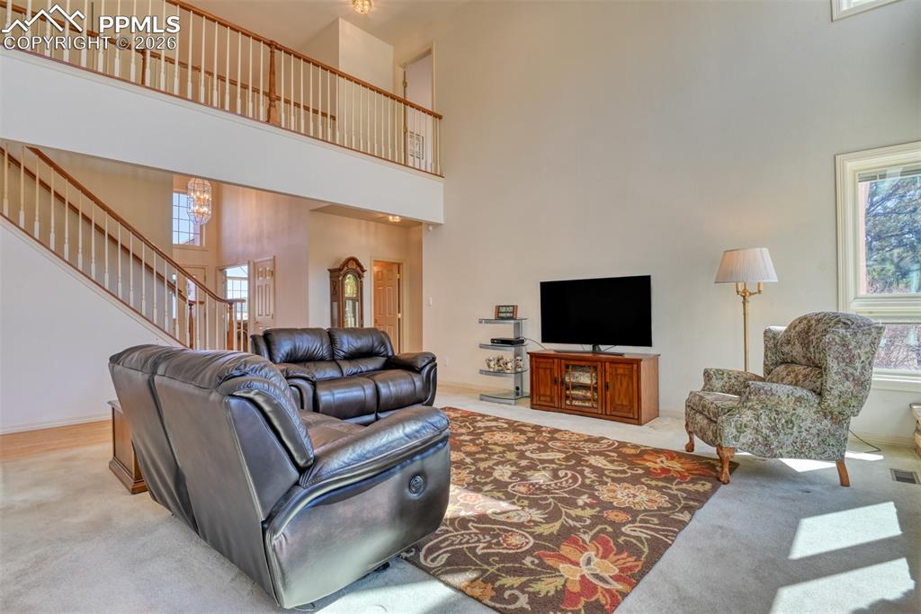 The spacious great room has soaring vaulted ceilings.