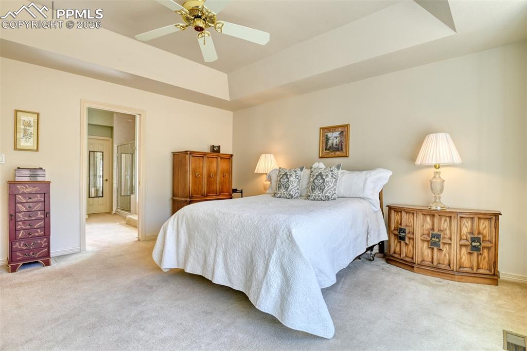 View looking toward the primary bathroom with soaking tub and massive walk-in closet. 