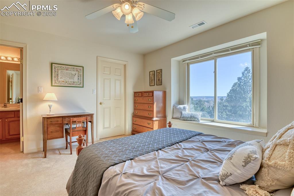 Walk-in closet and wonderful views of mountains and trees.