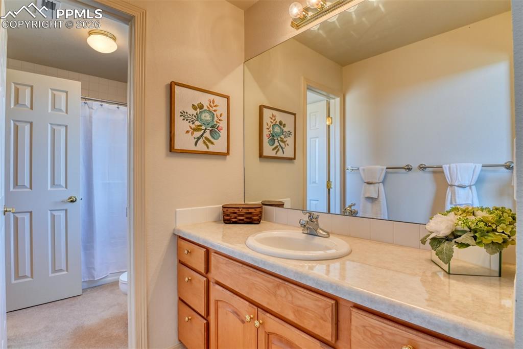 Can see a glimpse of the shower and toilet from this vanity located off bedroom #3/office. 