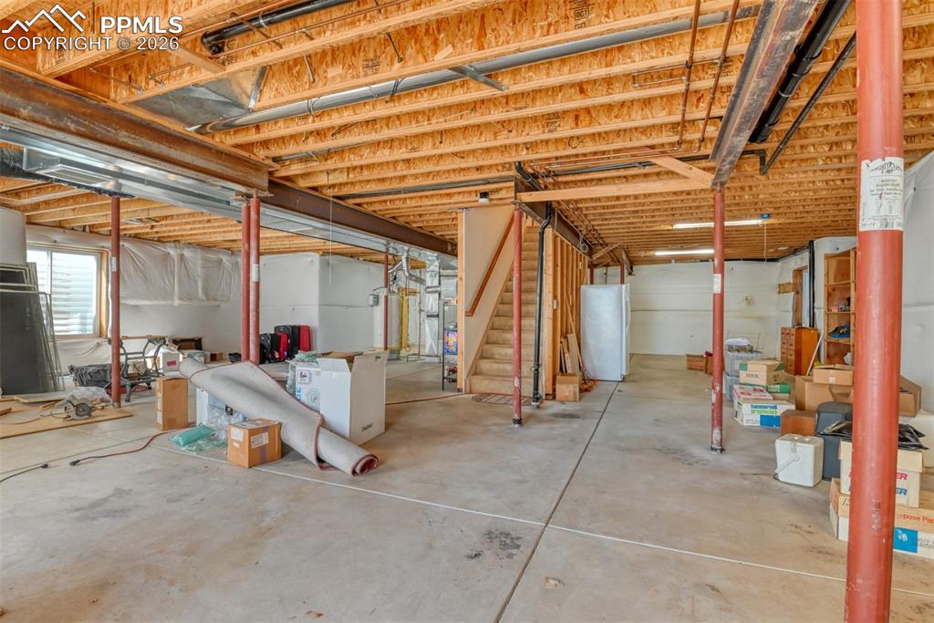 Unfinished basement provides room for expansion or warm space for children to play on a snowy day. 