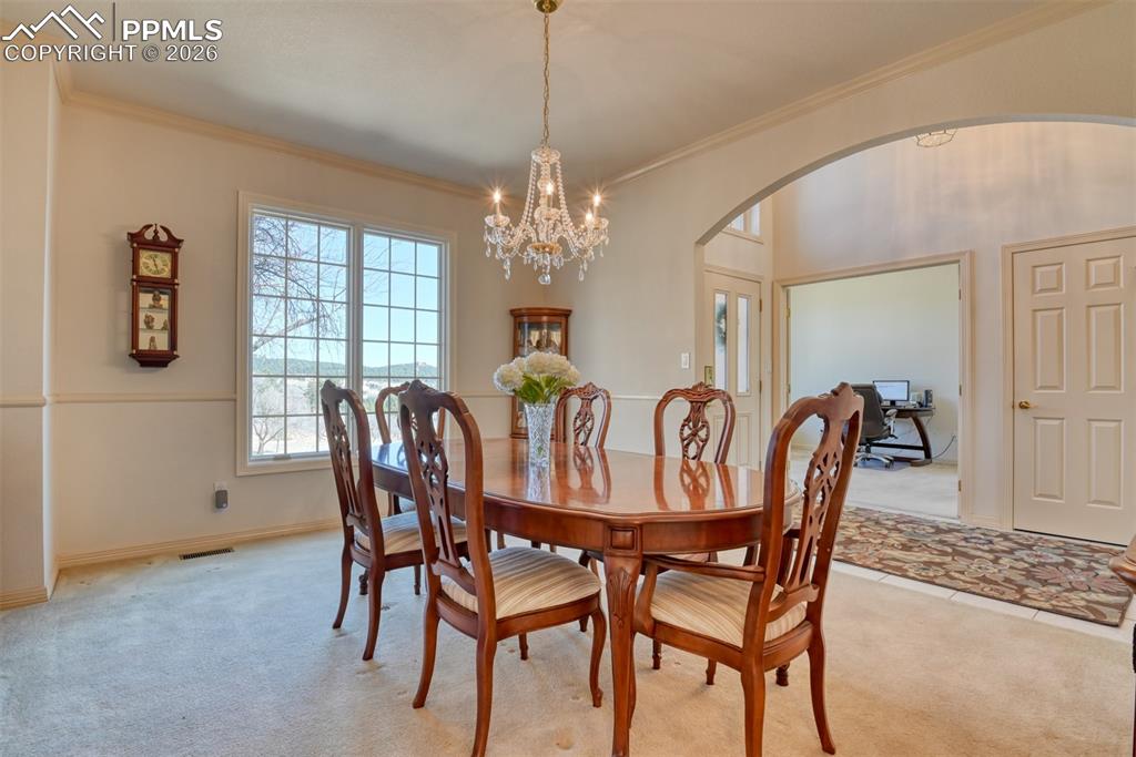 Dining room is located off the entry and right across from the office. Coat closet is also in the front entry. 