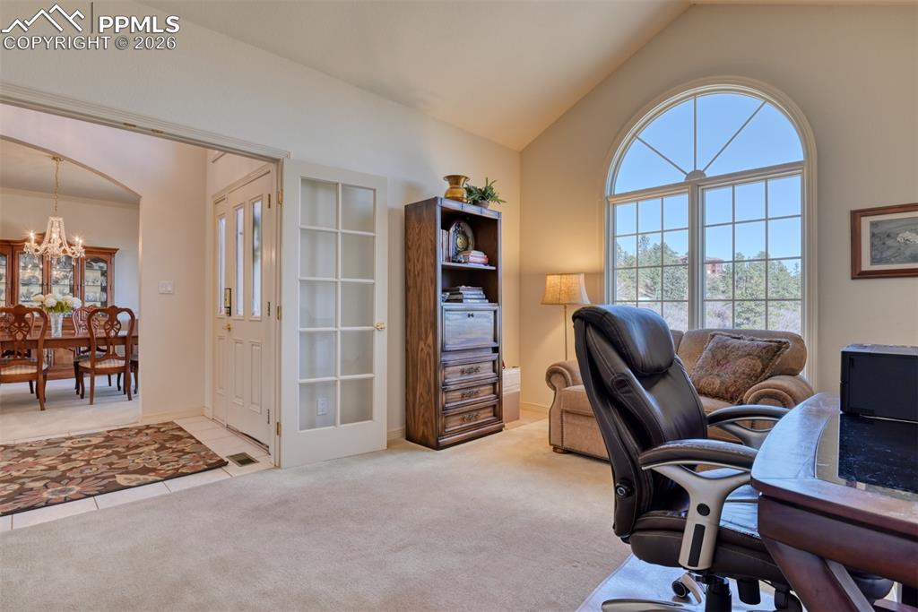 Main level office has French doors for privacy and has beautiful views of the front yard. 