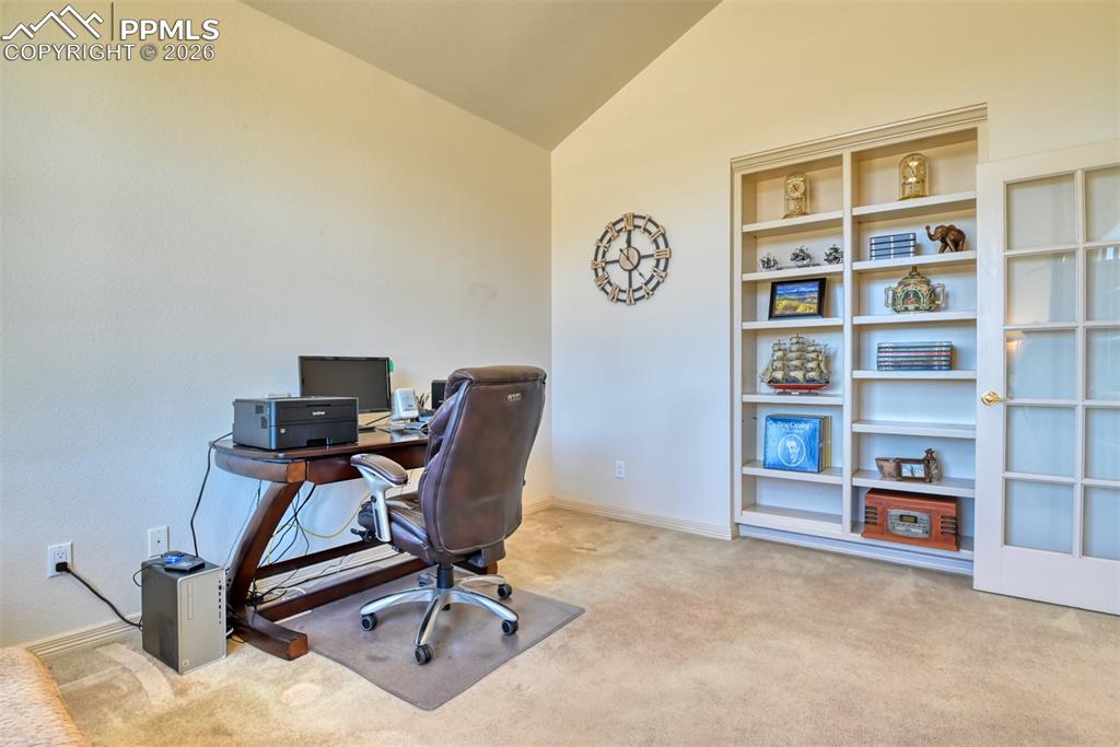 Office has adjustable built-in shelves. 