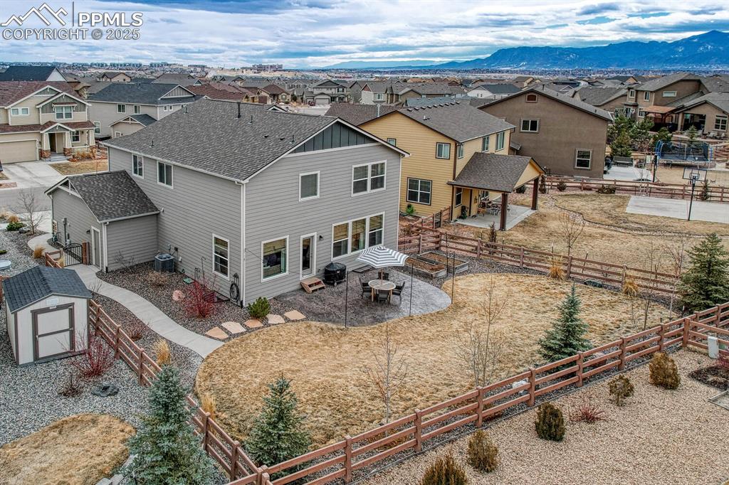 Drone / aerial view featuring a residential view and a mountain view
