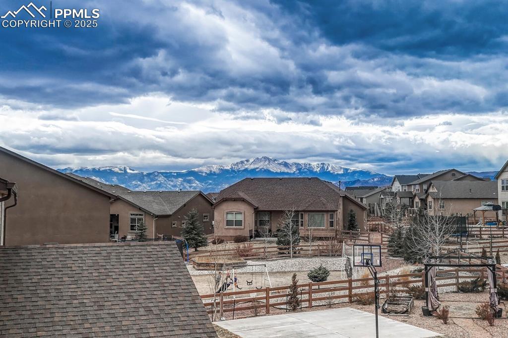 Property view of mountains featuring a residential view