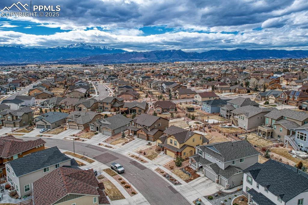 Birds eye view of property featuring a mountain view and a residential view