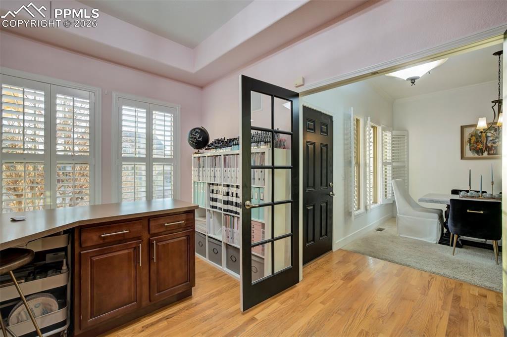 Double doors and plantation blinds in the front office