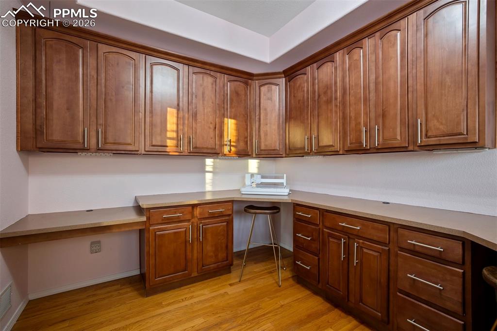 Built-in cabinets and U shaped desk in the front office