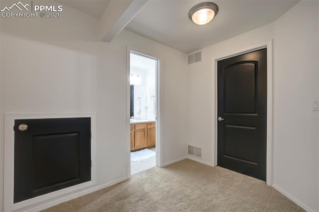 Locked storage under the stairs. Door to utility room