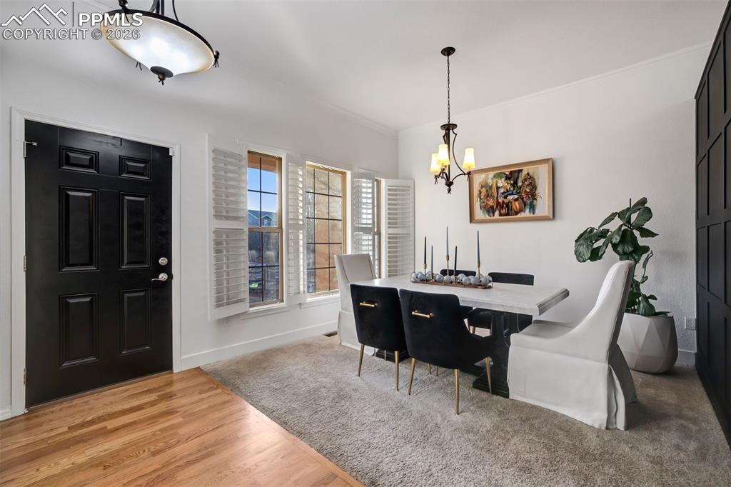 Front room with plantation blinds and accent wall